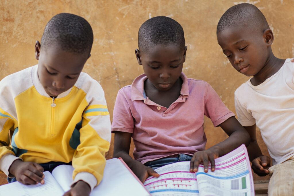 close up african kids reading together